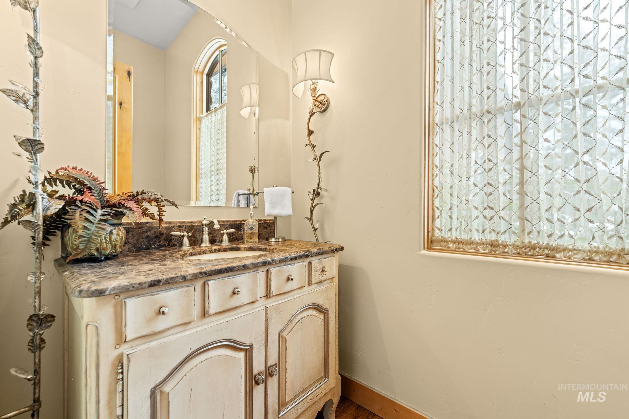 Half bathroom featuring vanity