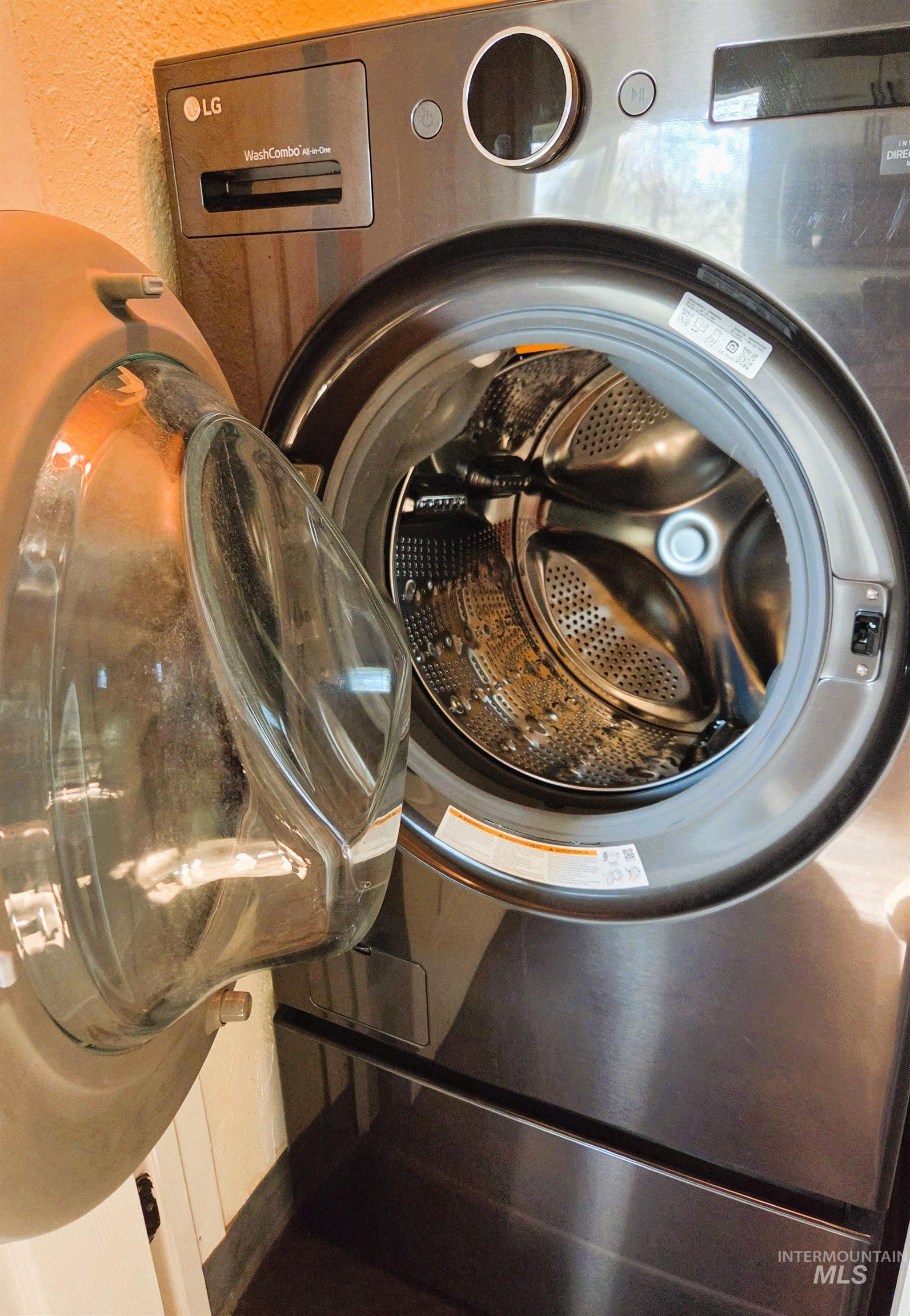 Stainless steel front-load washer-dryer combination unit with a clear glass door