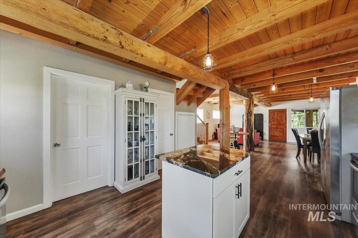 Exposed wood beam ceiling with wood-finish flooring