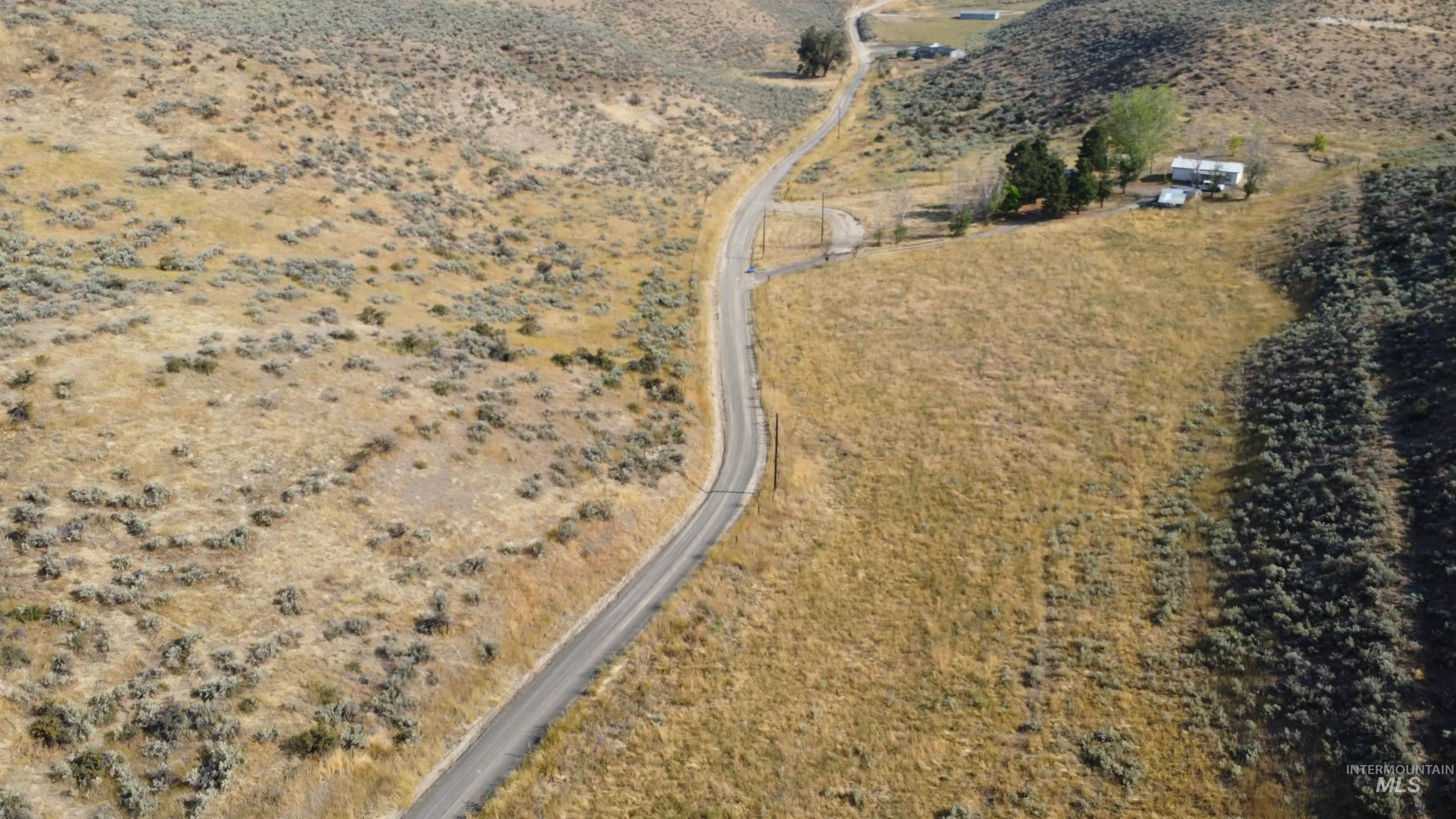 Aerial view of property and surrounding area with rural landscape
