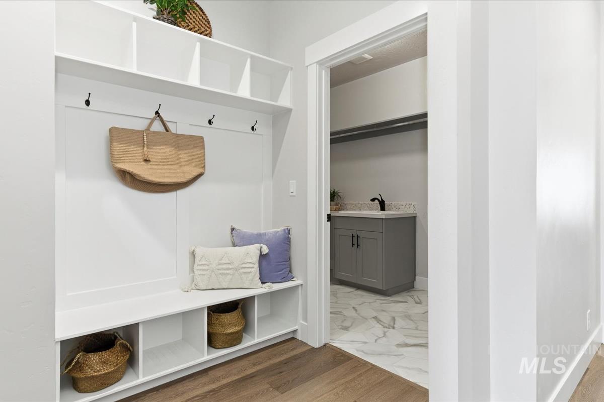 Mudroom with wood finished floors