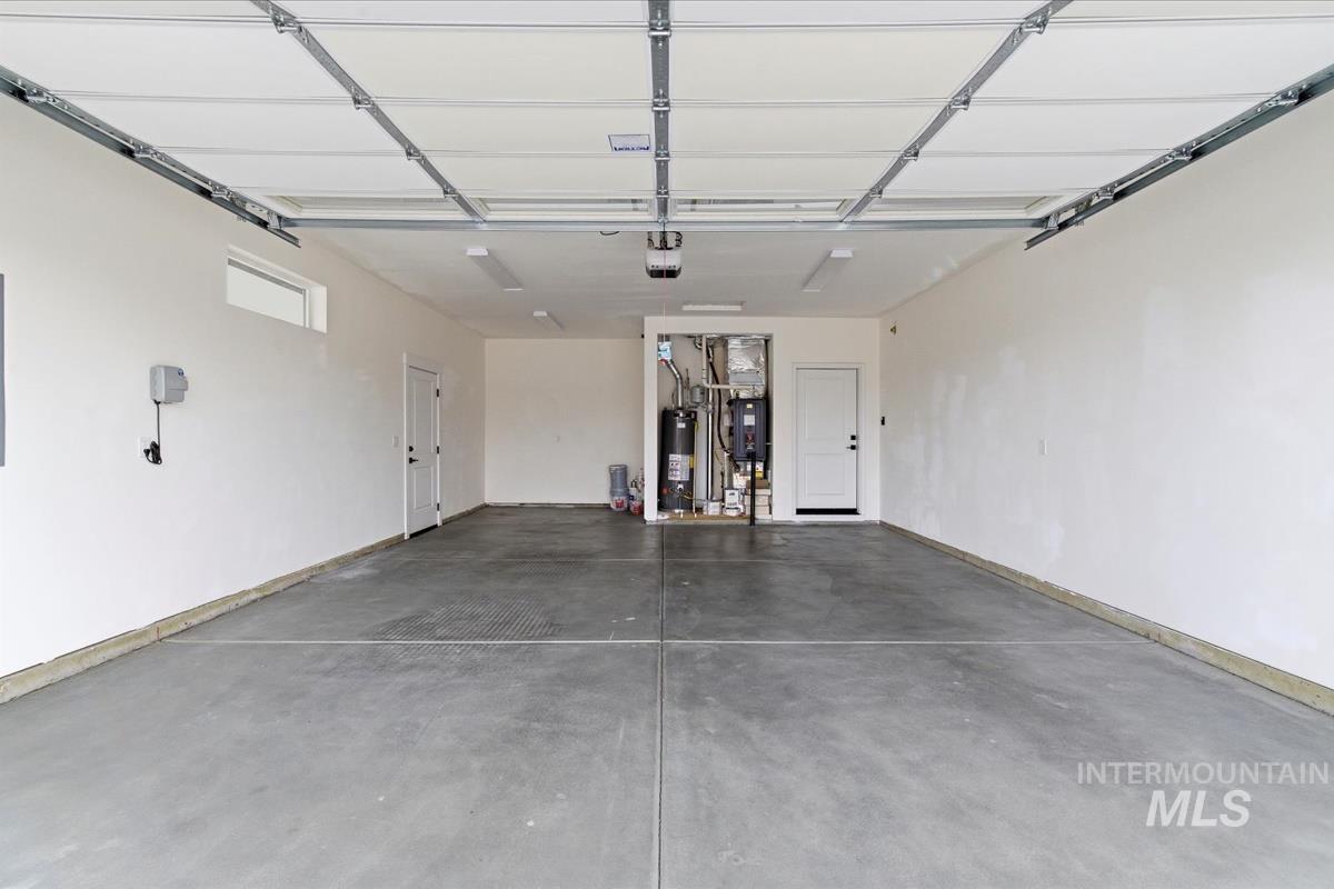 Garage featuring water heater