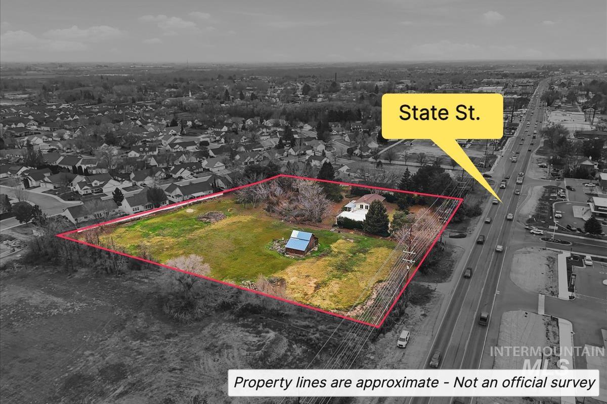 Aerial view of residential area with property parcel outlined