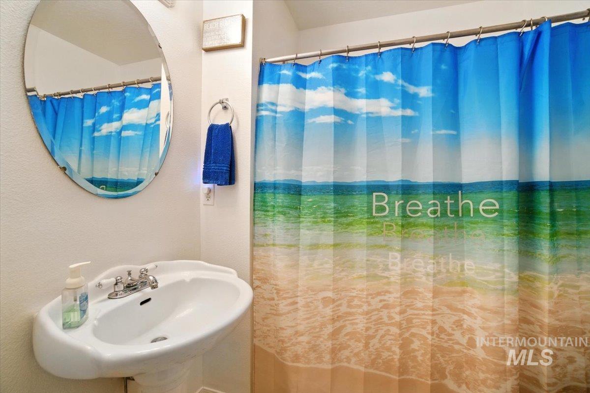 Full bath with curtained shower