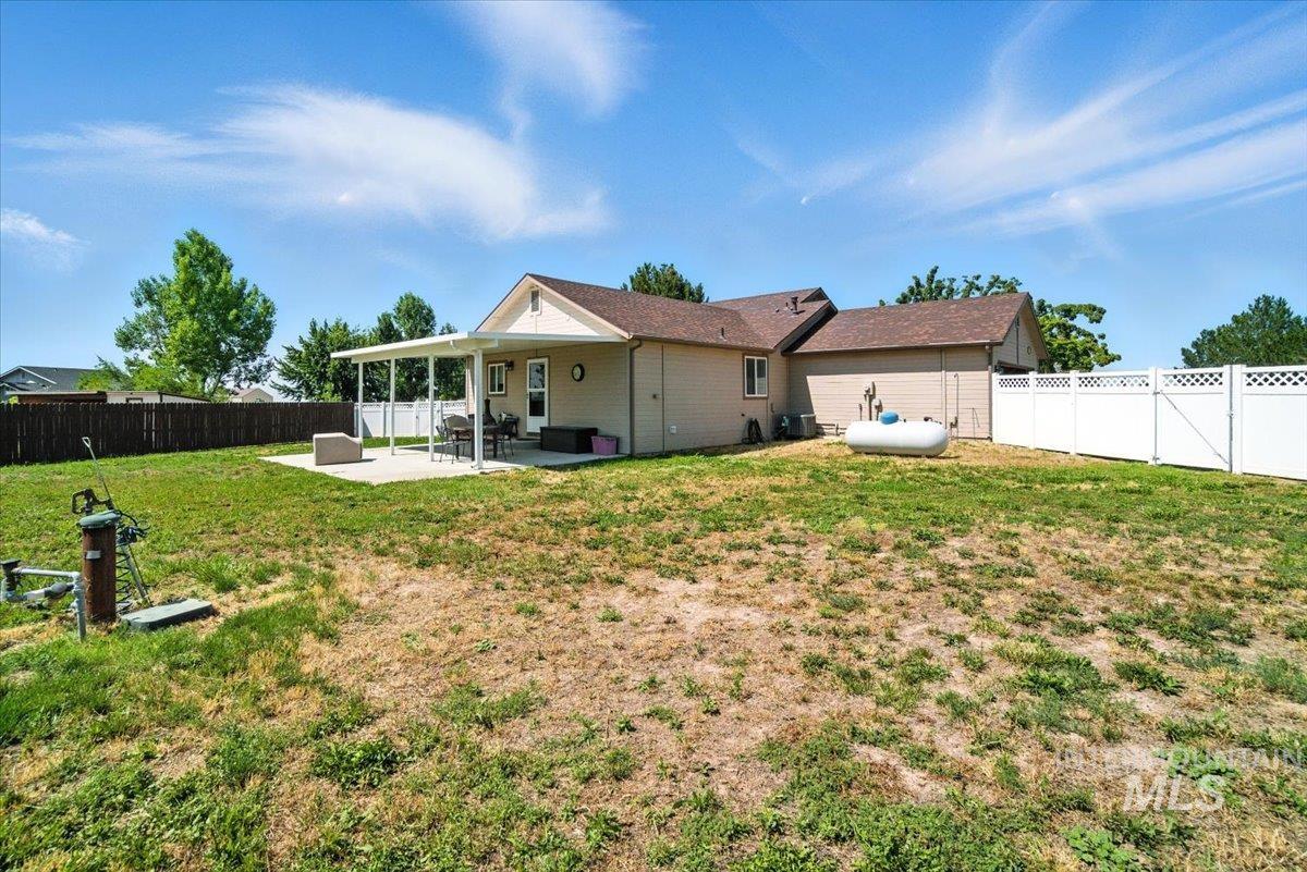 Back of house featuring a patio and a fenced backyard