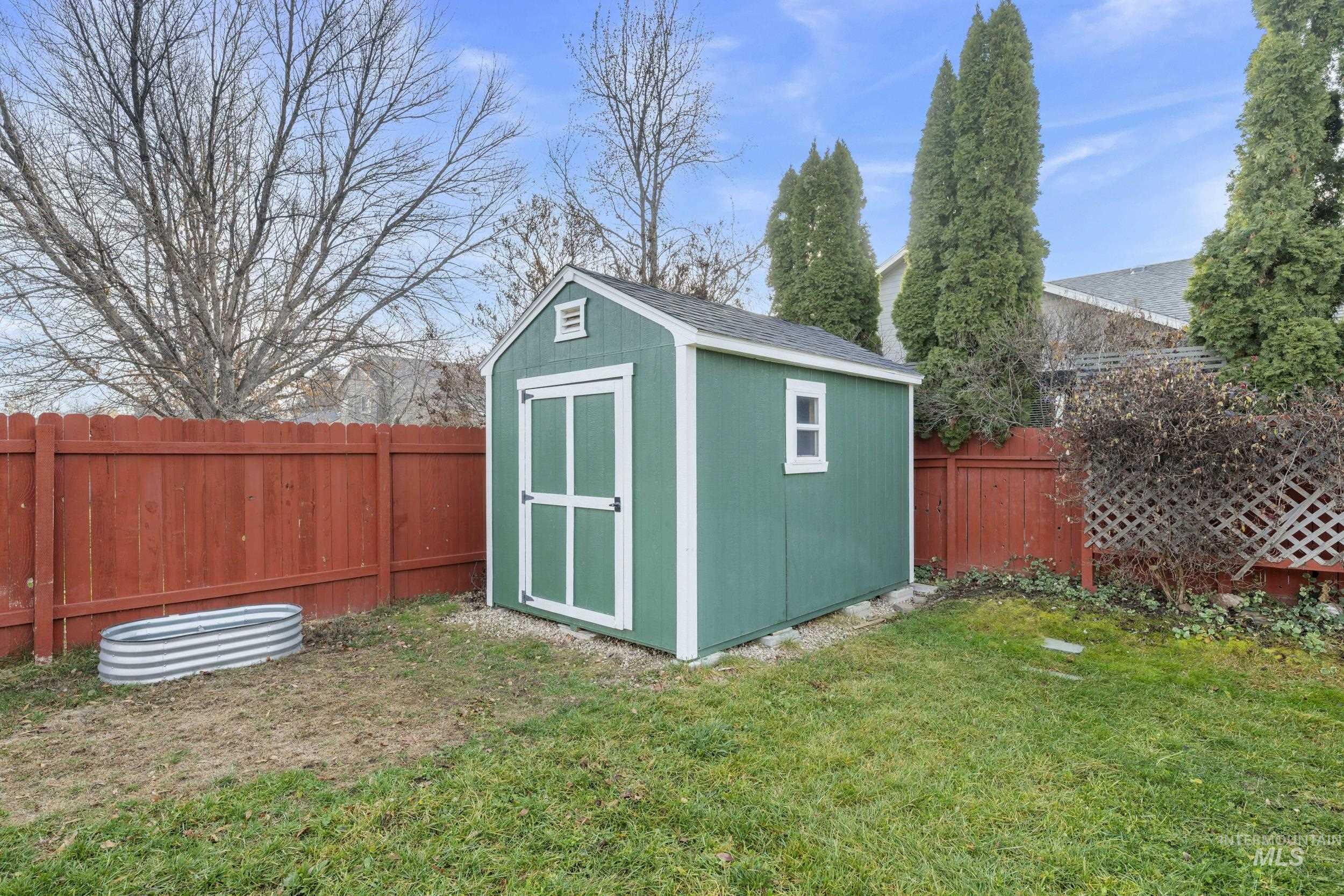 View of shed featuring a fenced backyard