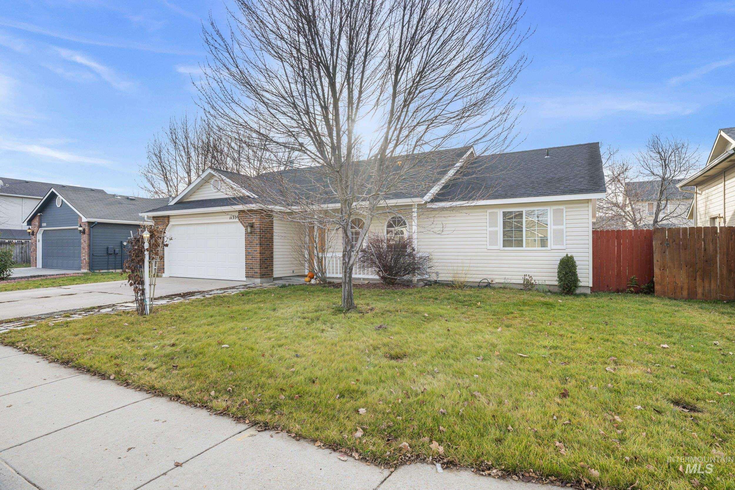 Ranch-style house with driveway and a garage