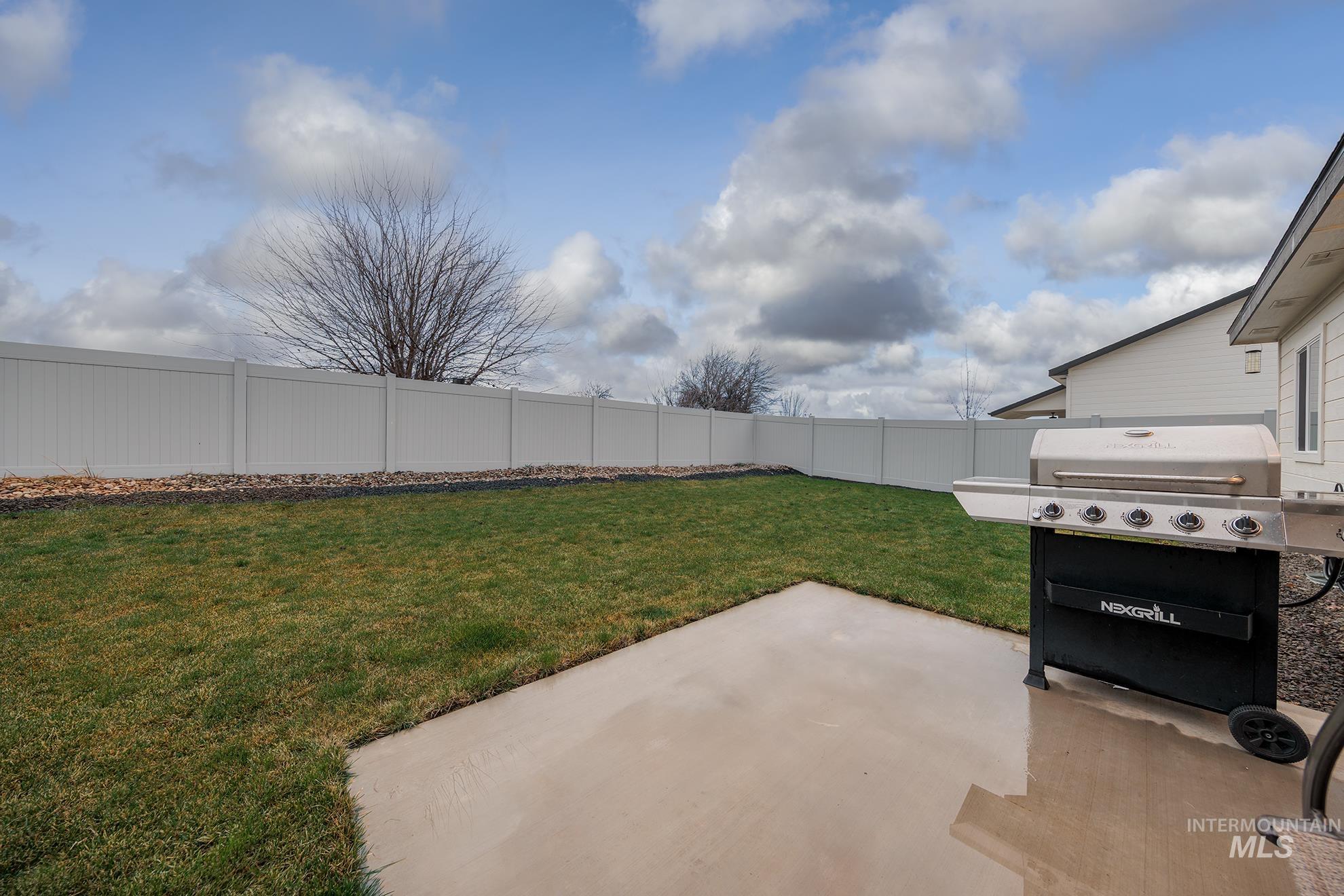 Fenced backyard featuring a patio area