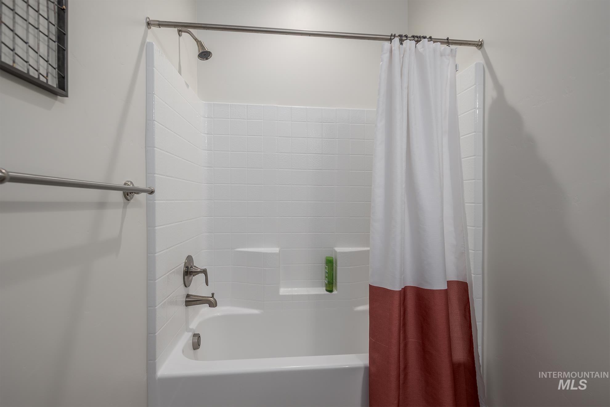 Full bath featuring shower / bath combo