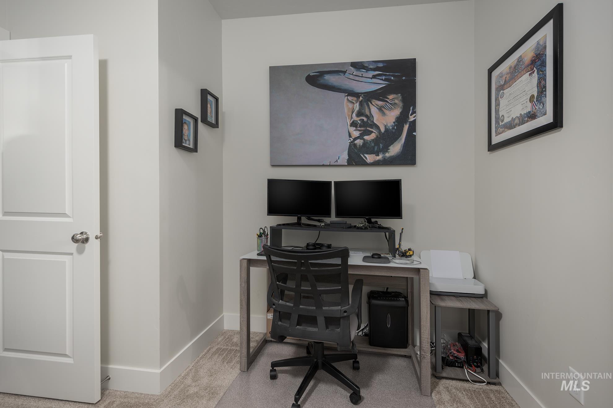 Office featuring carpet and baseboards