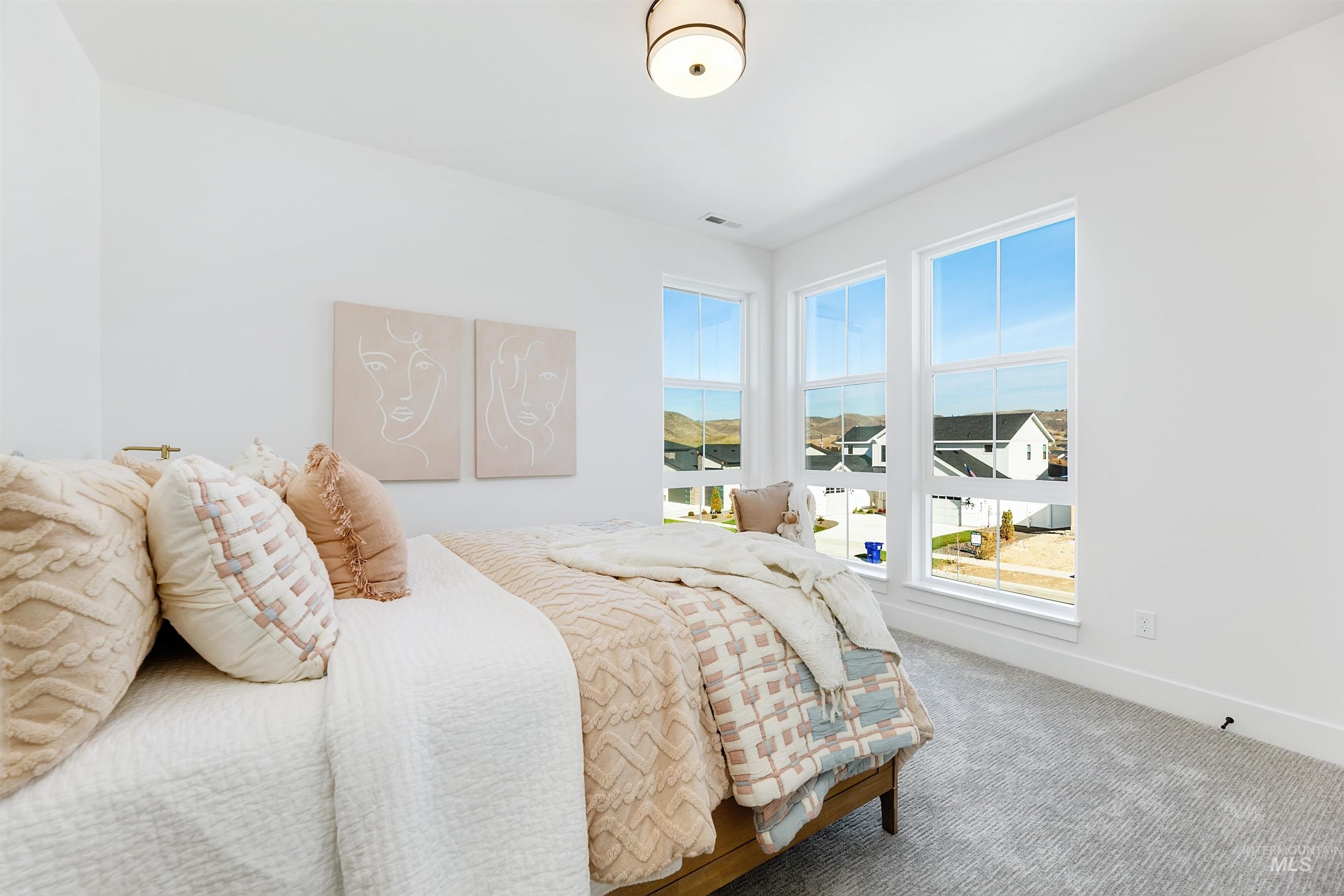 Bedroom with carpet and baseboards