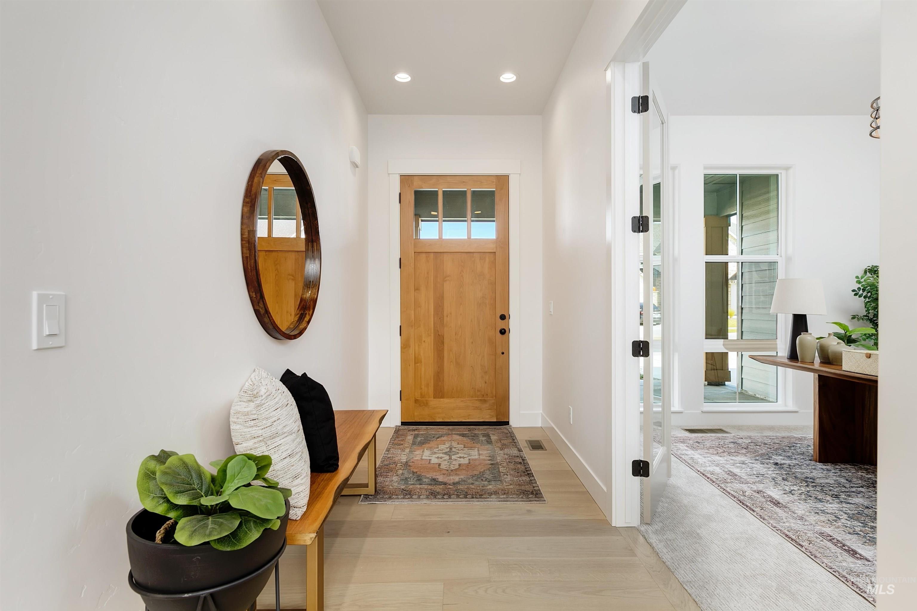 Entryway featuring recessed lighting and wood finished floors