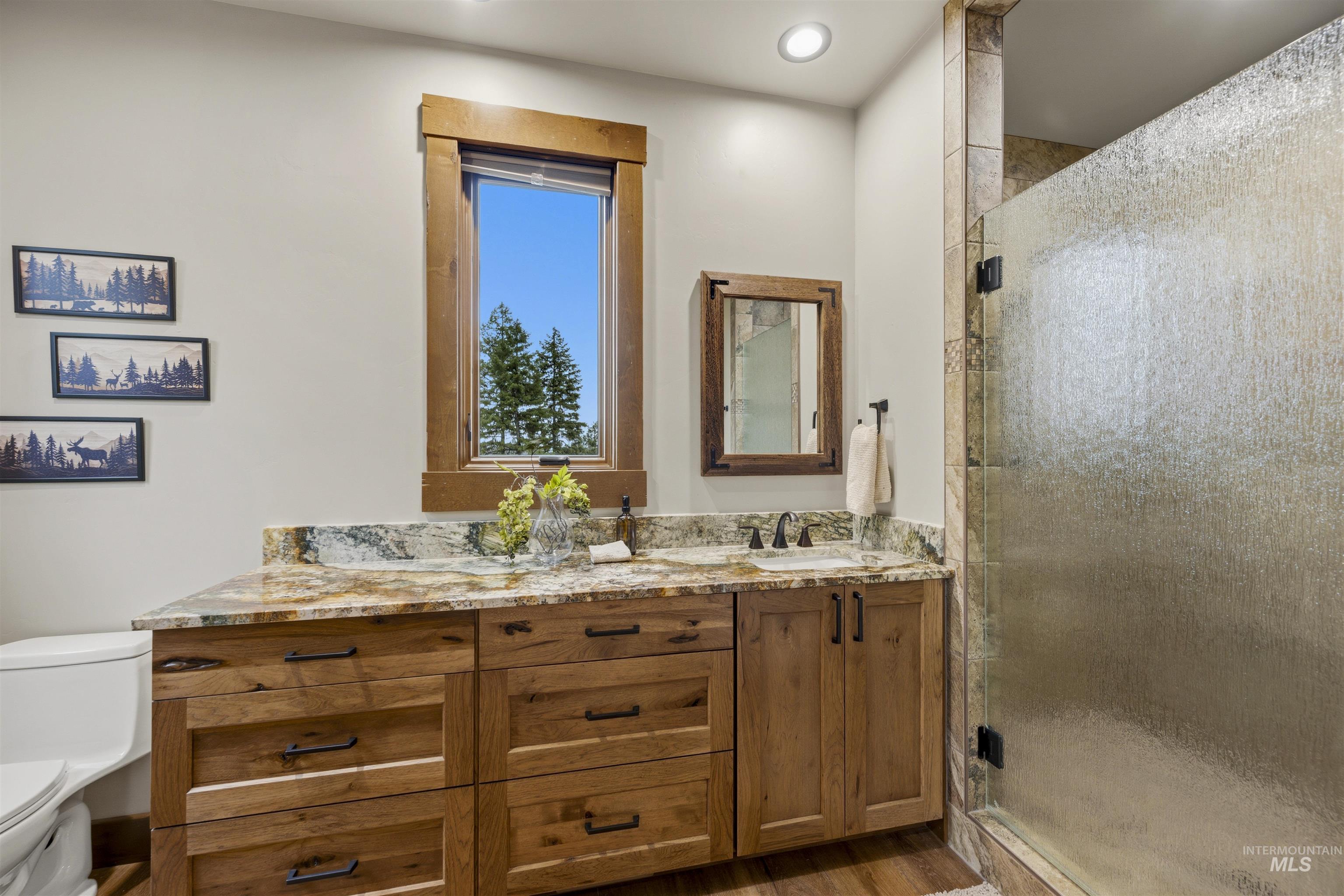 Dual vanity with stone countertop and integrated sinks - Ensuite to Second Bedroom