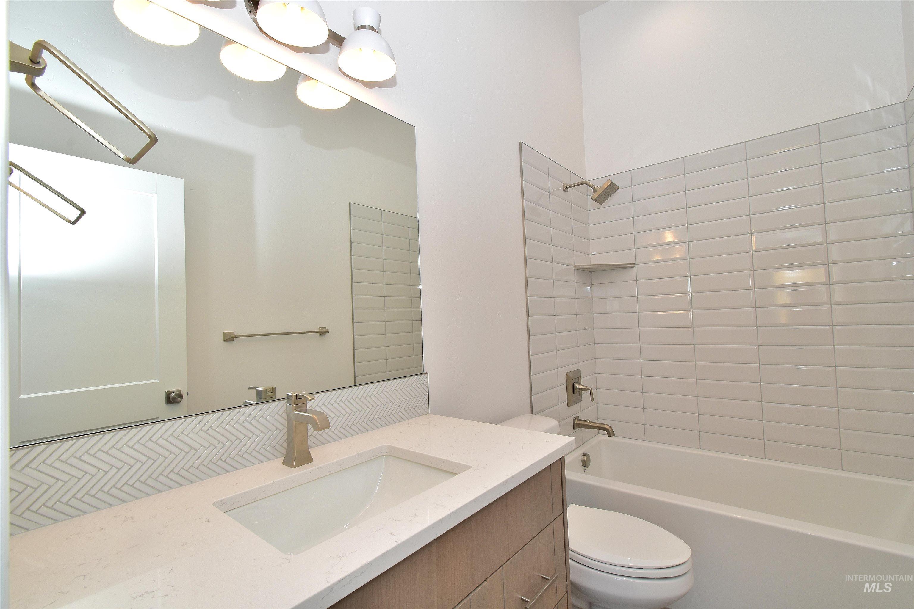 Full bathroom featuring bathtub / shower combination and vanity