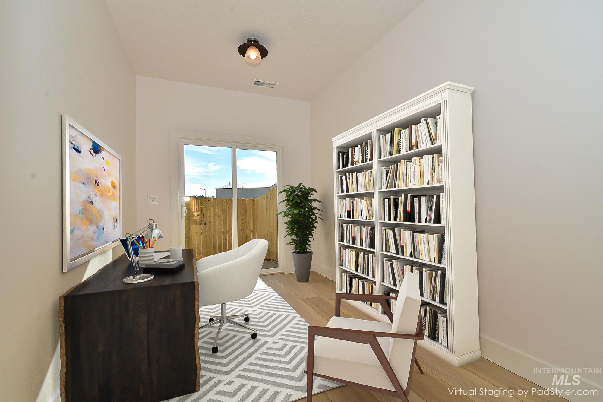 Home office featuring light wood finished floors and baseboards