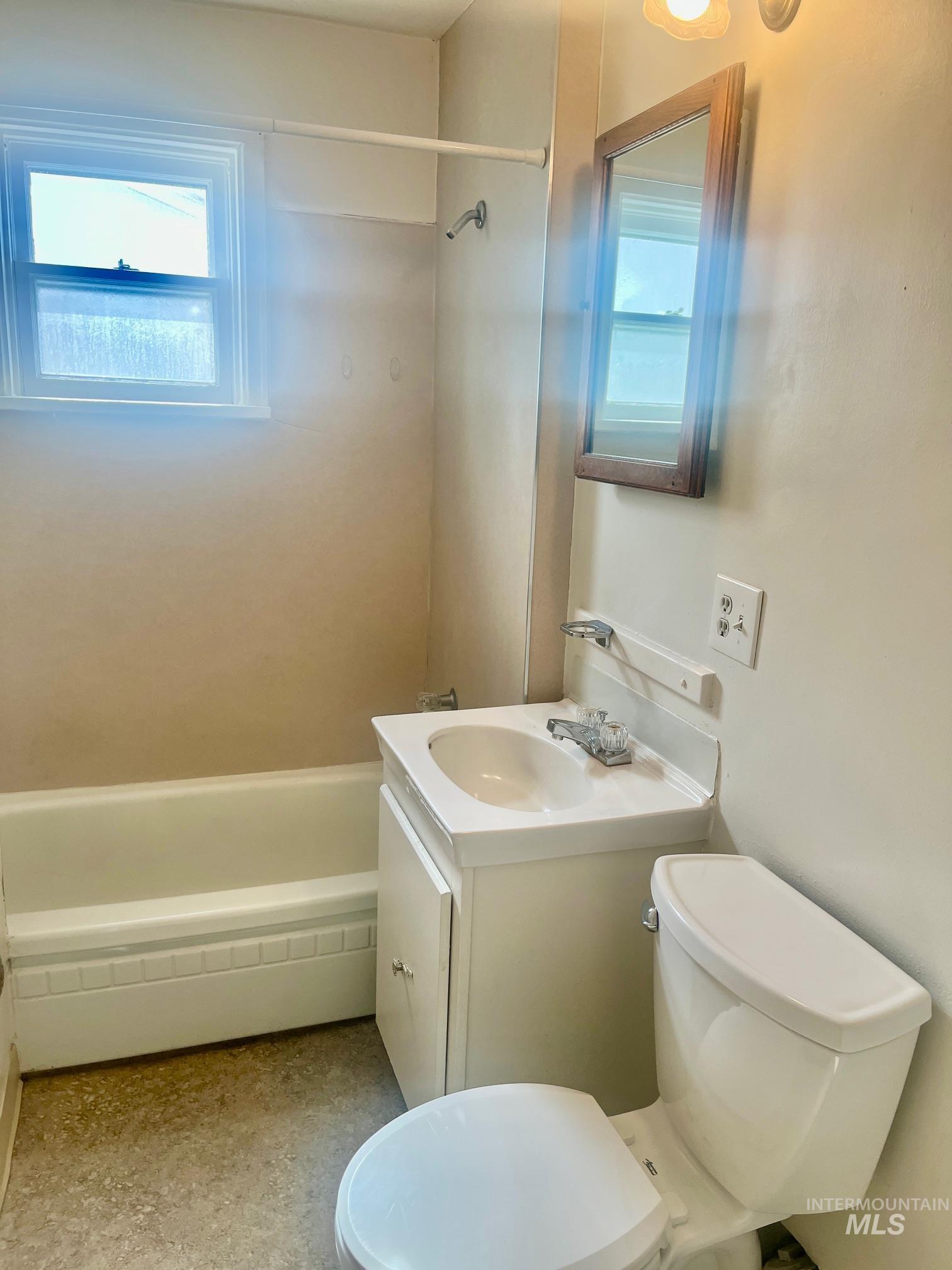 Full bath with vanity and shower / washtub combination