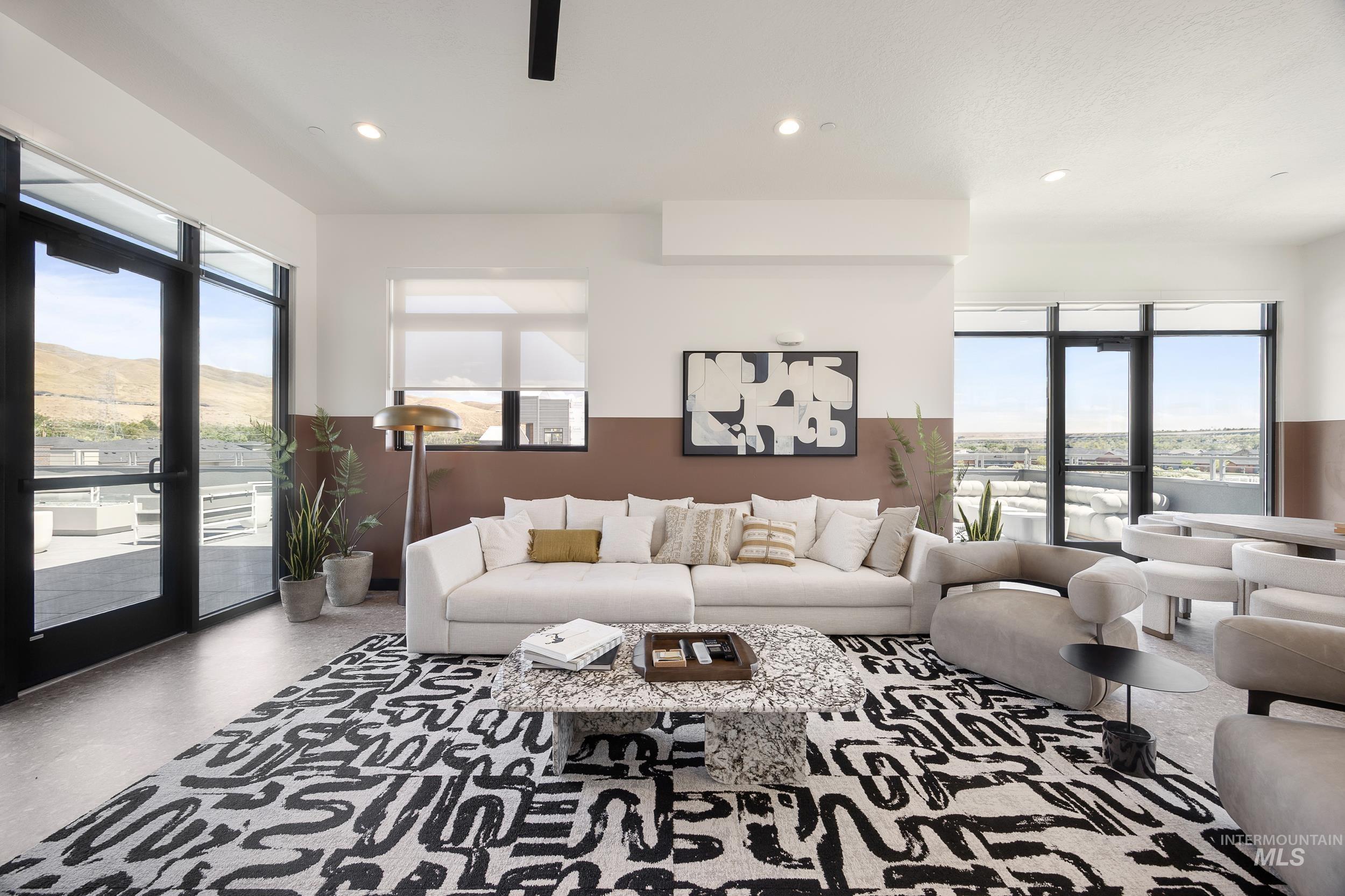 Living room featuring healthy amount of natural light, recessed lighting, and a mountain view
