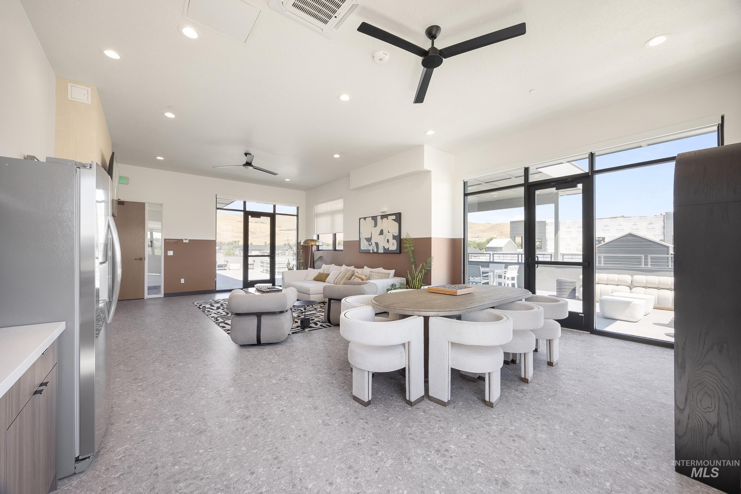 Dining area with ceiling fan and recessed lighting