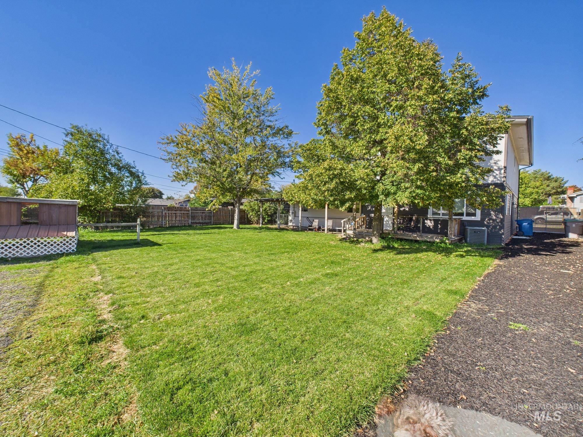 Fenced backyard with a patio area