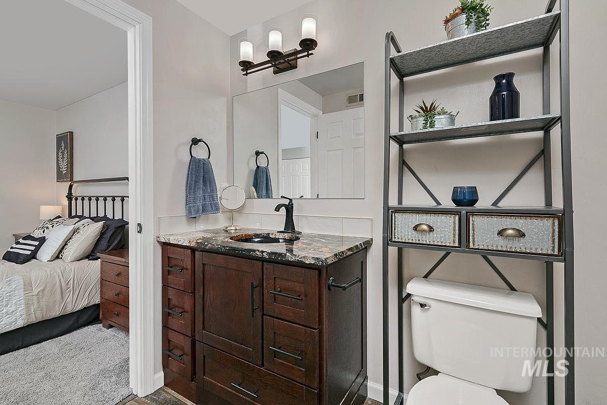 Ensuite bathroom with vanity and toilet
