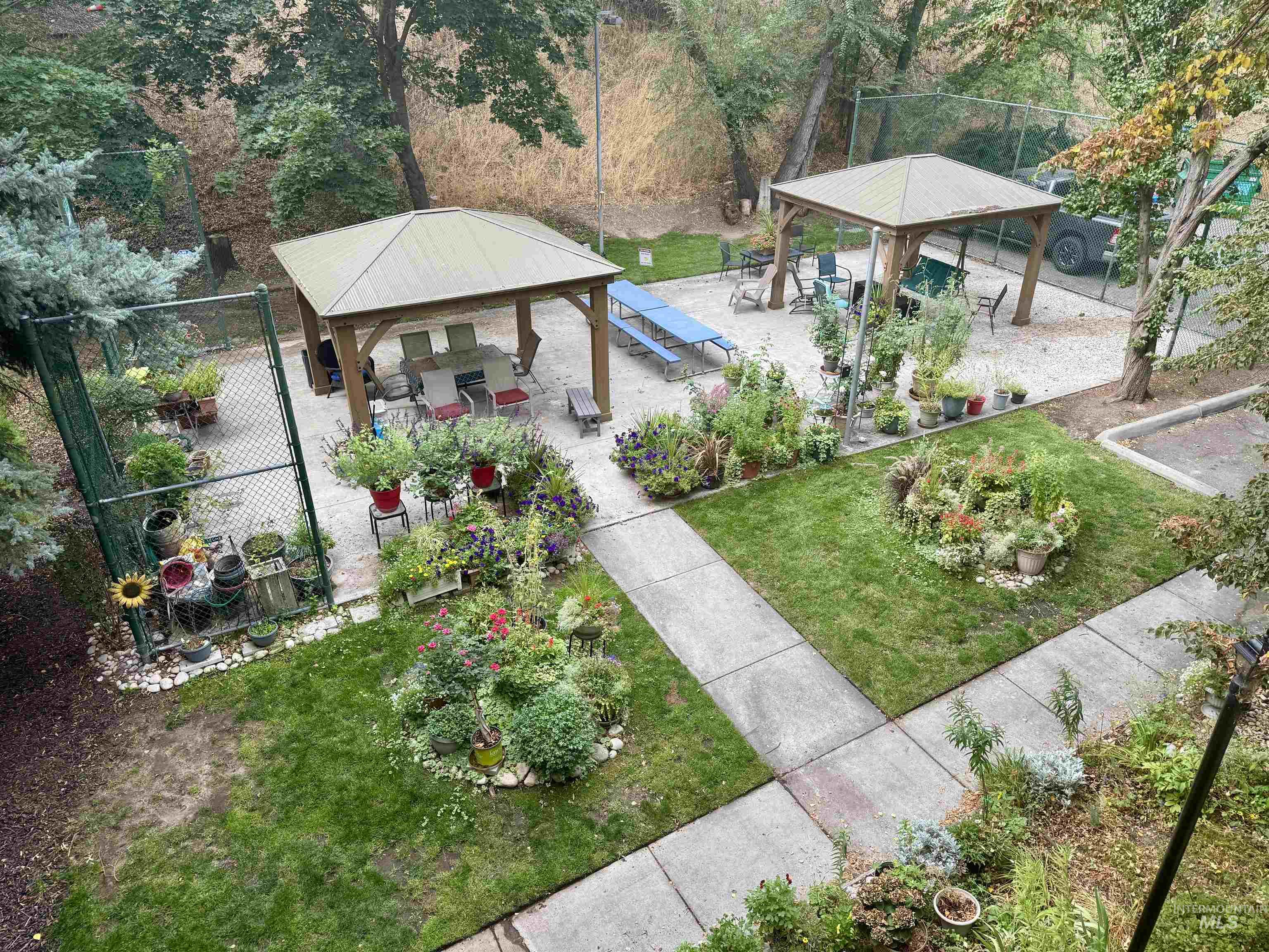 View of yard featuring a gazebo, a patio, and view of wooded area