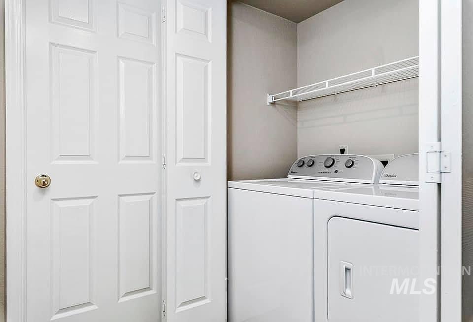 Laundry room with washer and clothes dryer