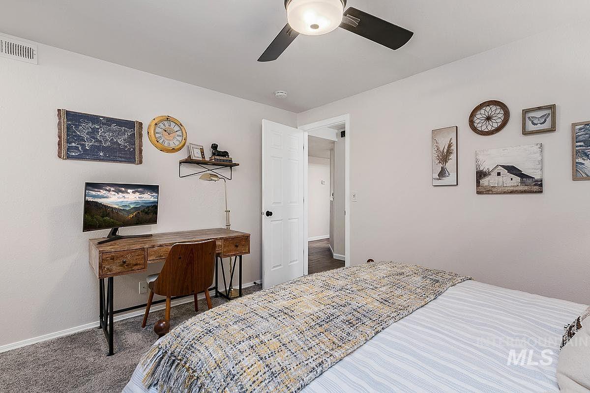 Bedroom with carpet floors and ceiling fan