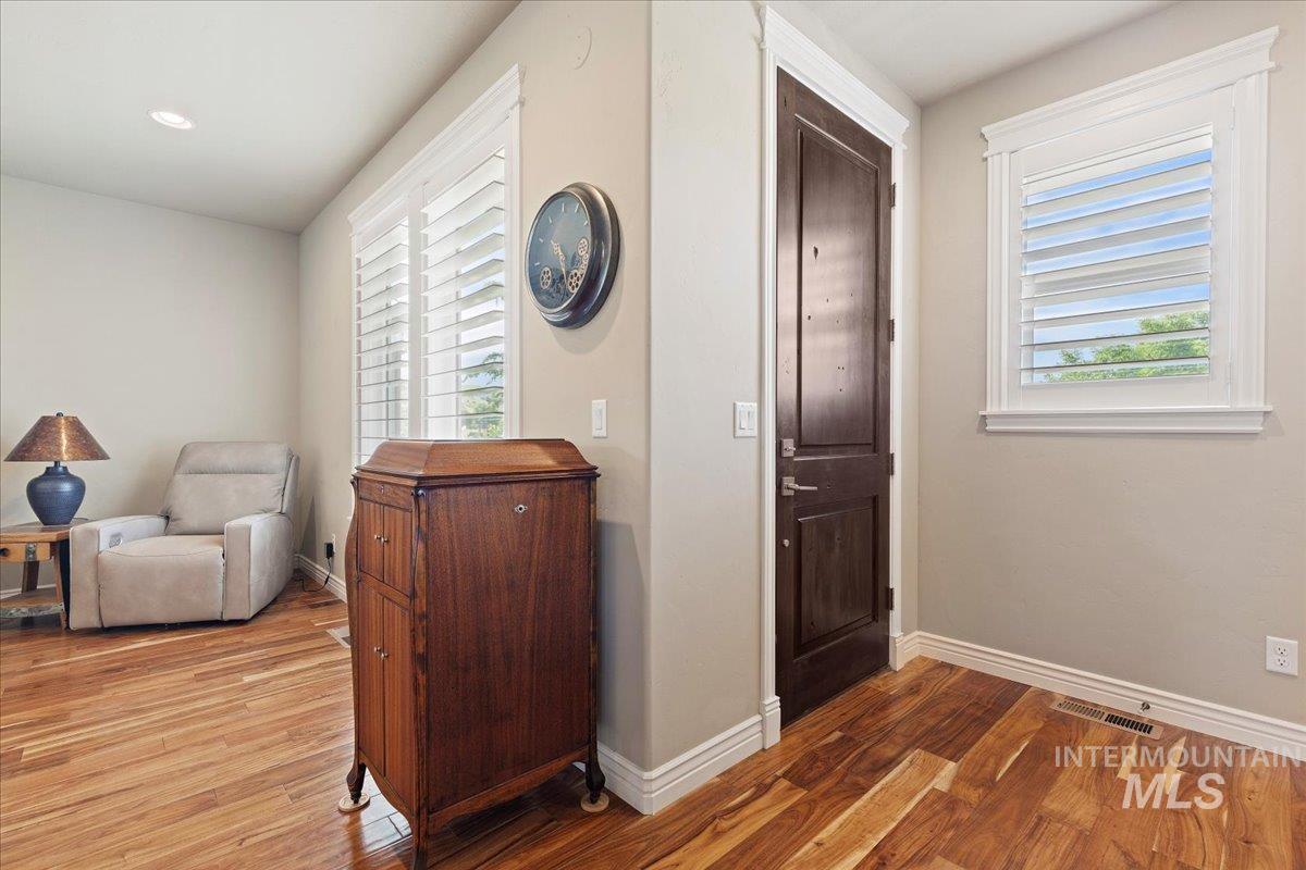 Foyer with light wood-style flooring