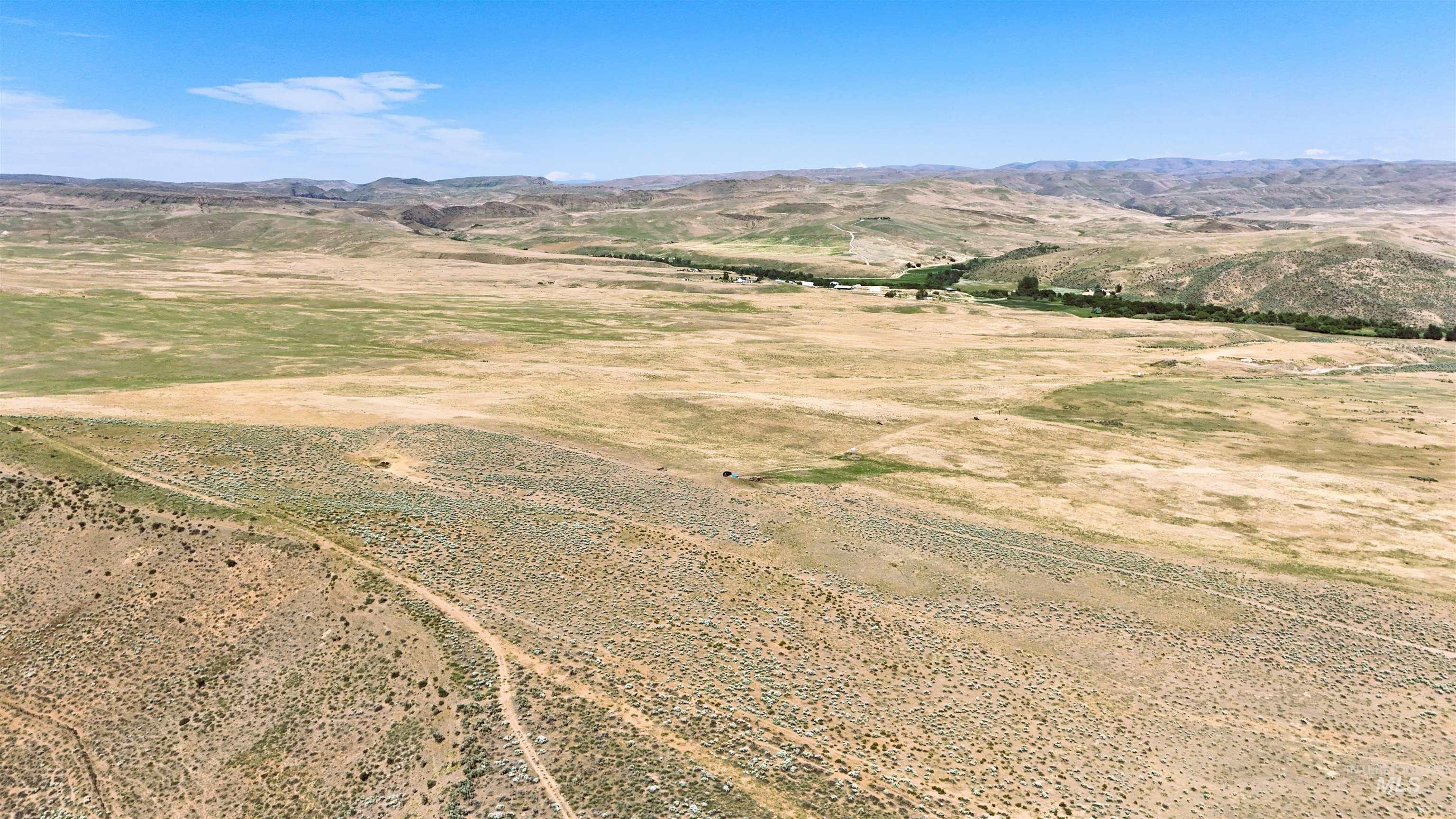 Aerial view of sparsely populated area with a mountain backdrop