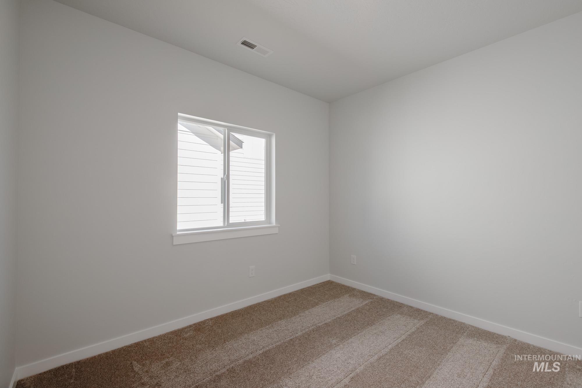 Spare room with carpet flooring