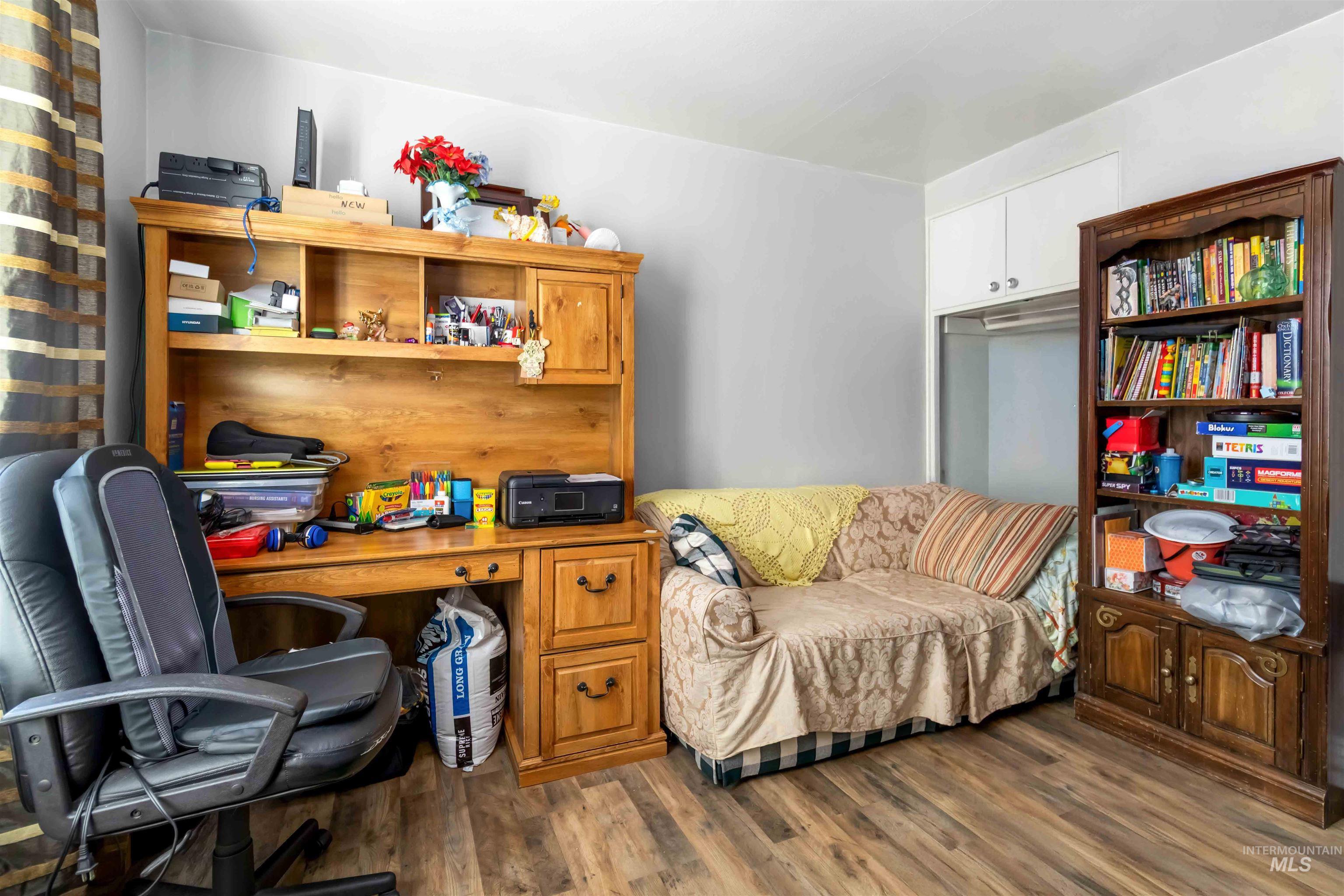 Office with wood finished floors