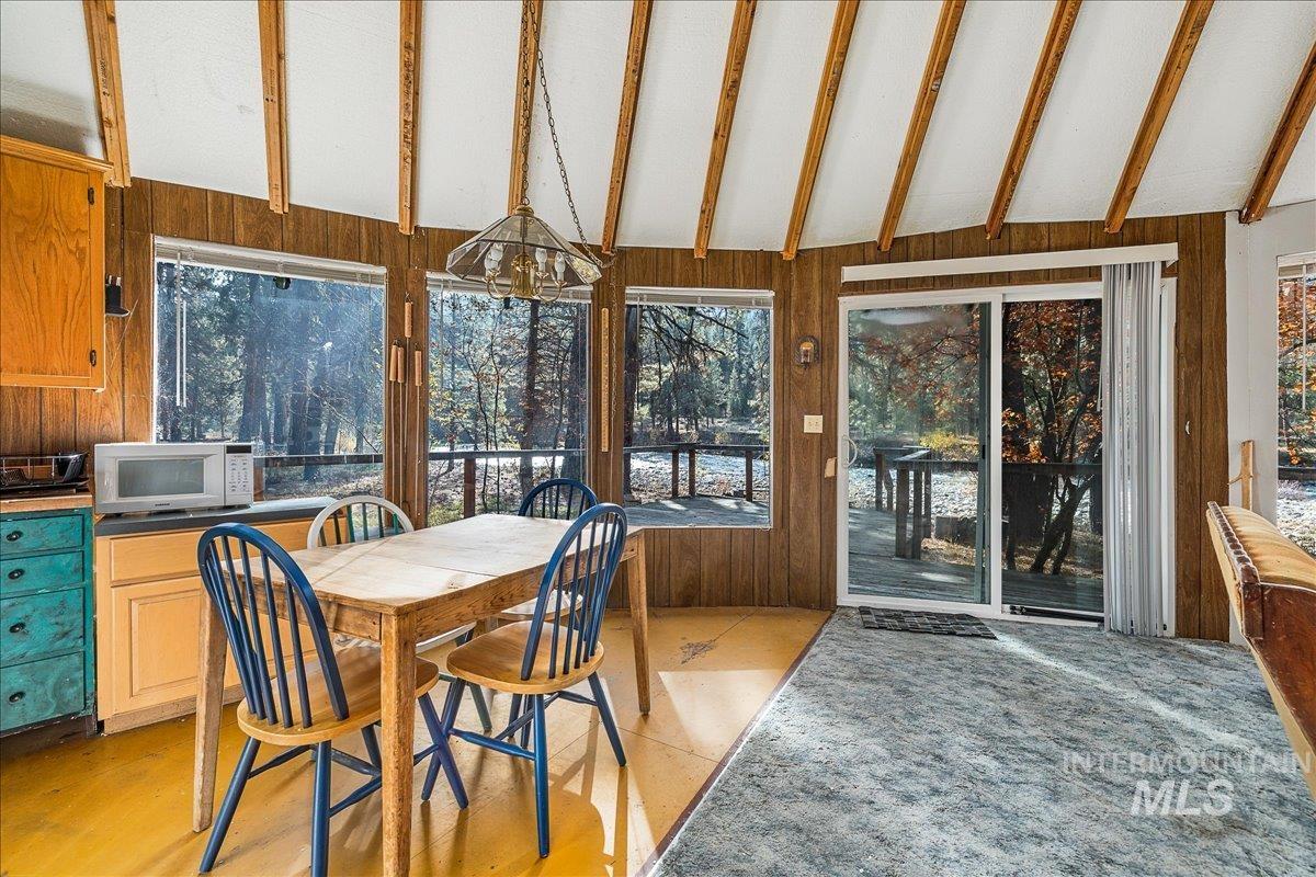 Sunroom with wooden walls