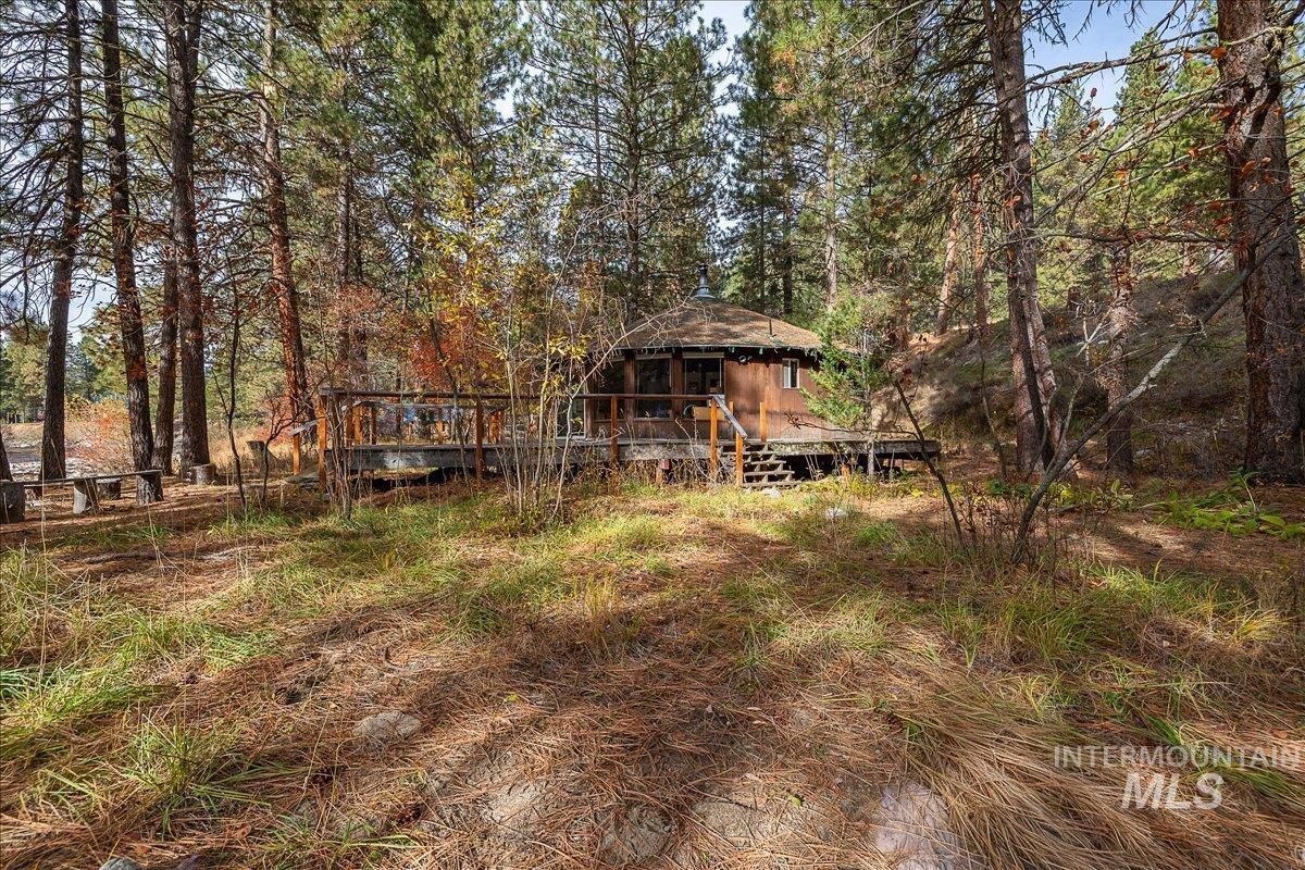 View of yard with a wooden deck