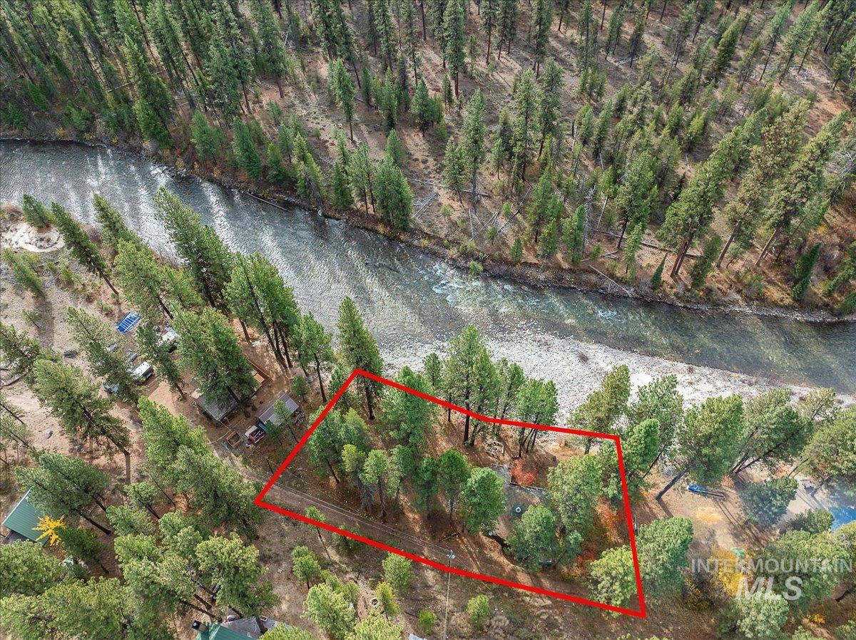 View of property location featuring a large body of water and property parcel outlined