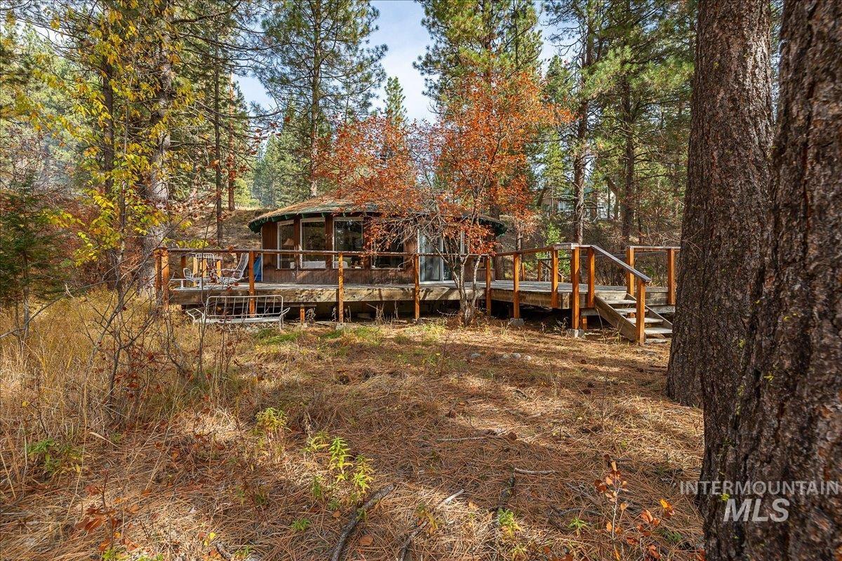 Back of house with a wooden deck