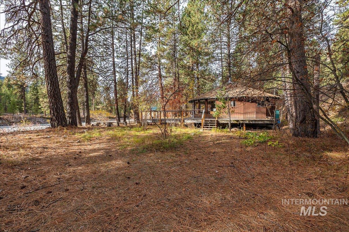 View of yard with a wooden deck