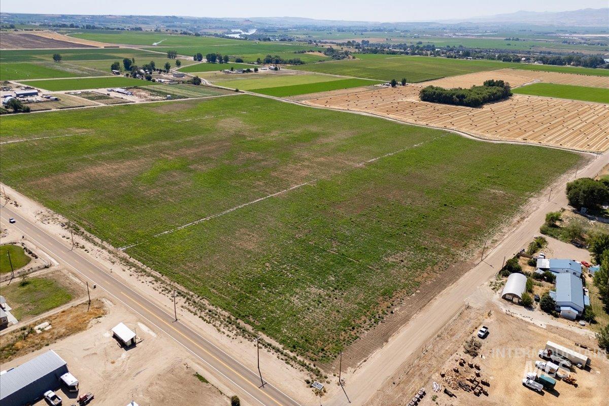 Aerial view of sparsely populated area with large plots for crops