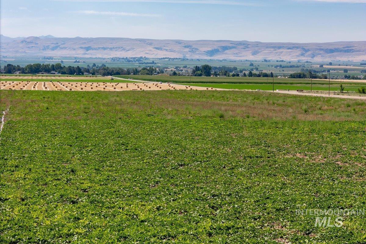 View of mountain background featuring rural landscape
