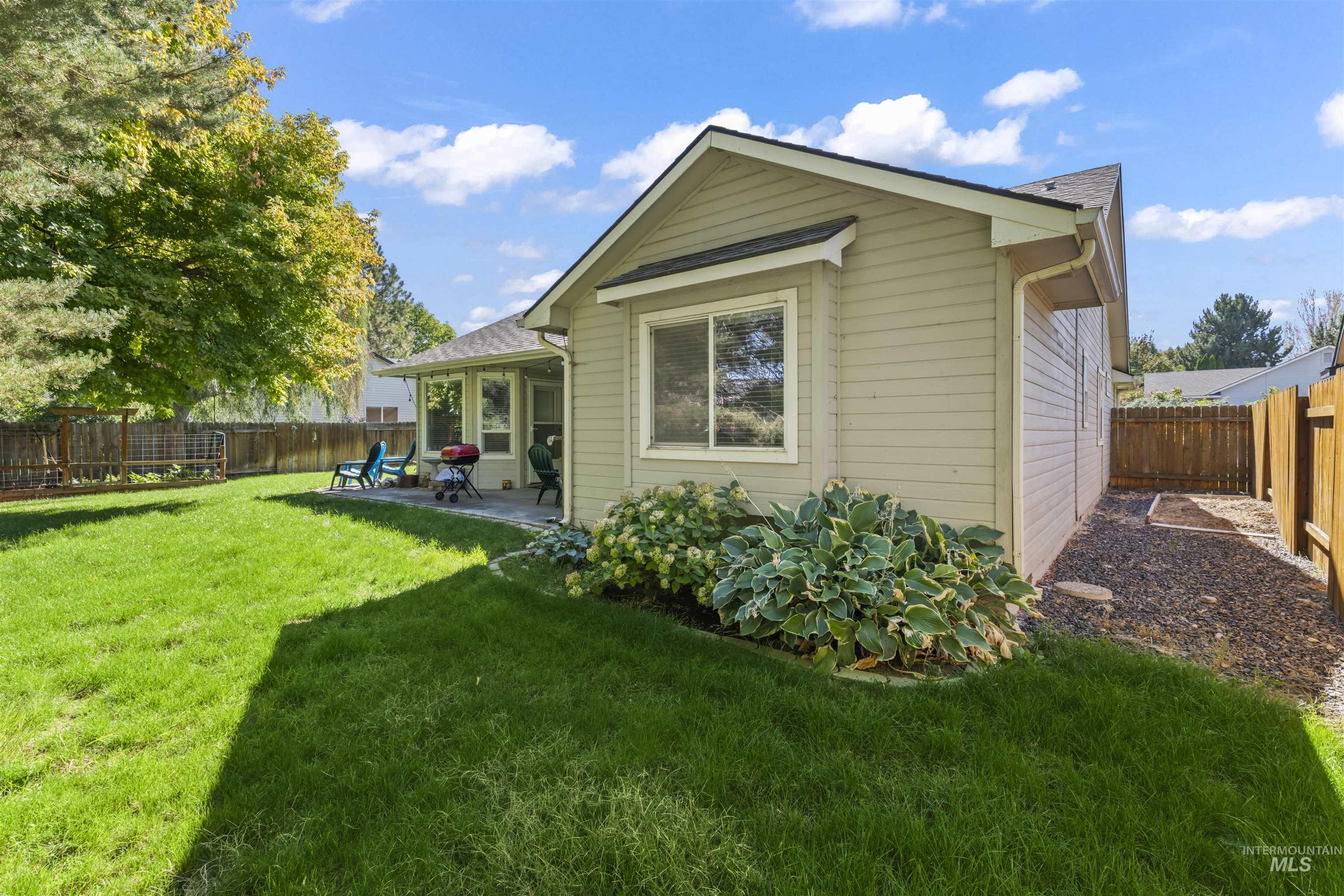 Rear view of property featuring a patio area and a fenced backyard
