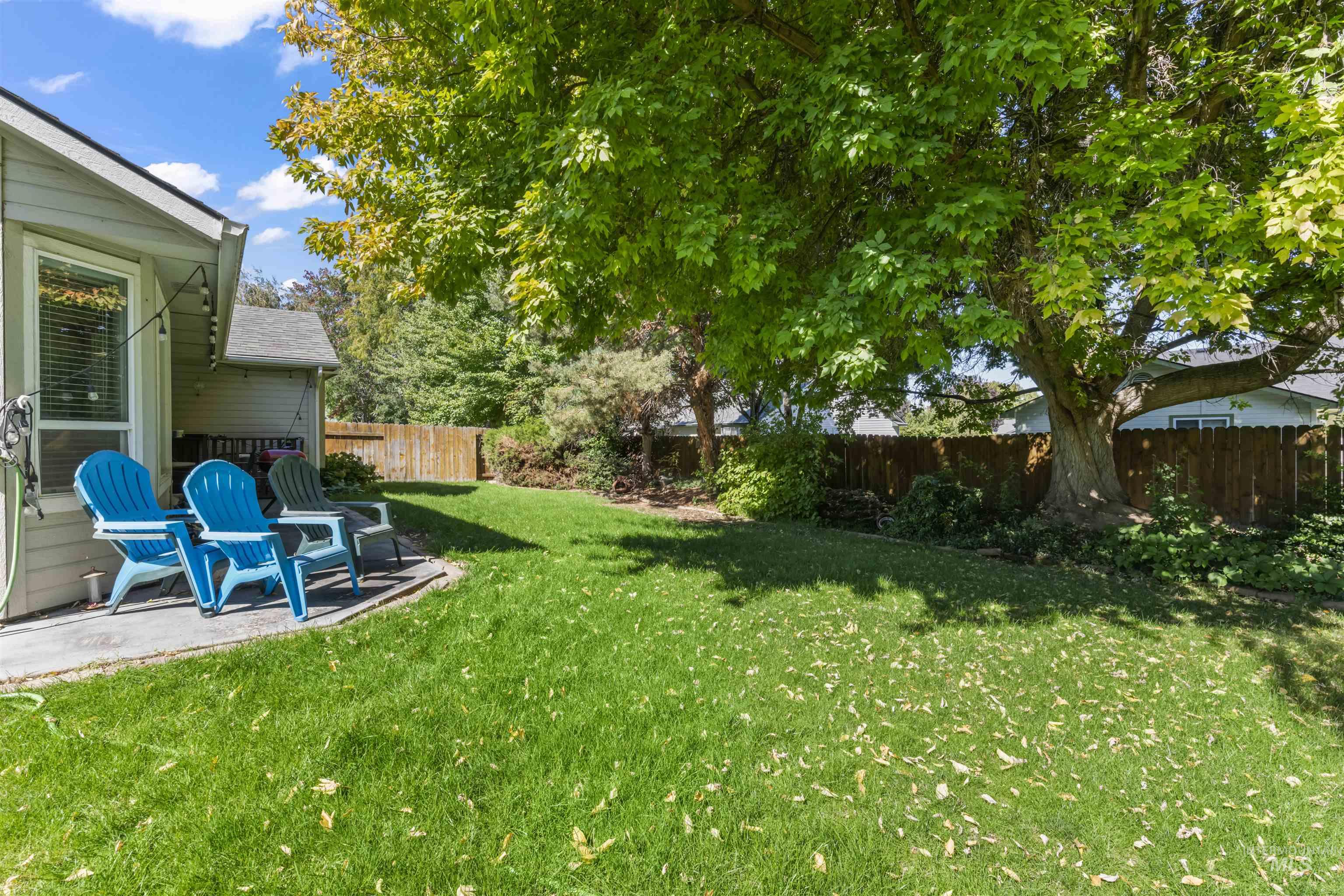 Fenced backyard with a patio area