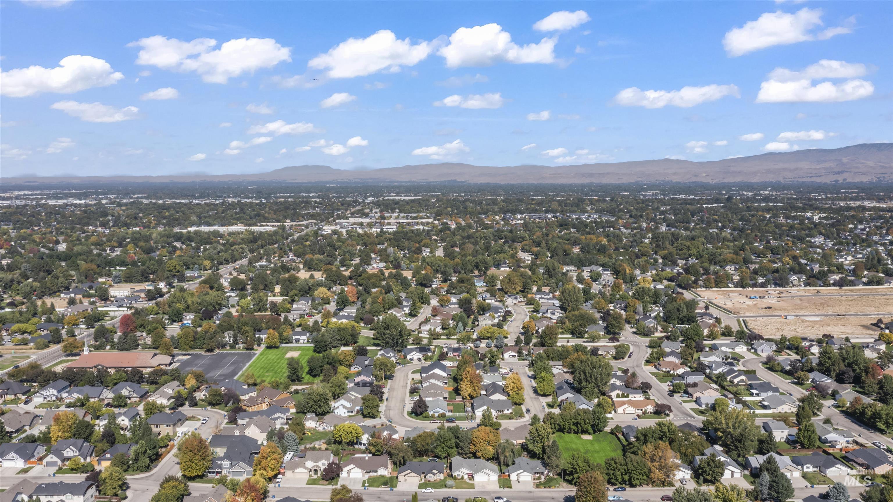 Aerial perspective of suburban area featuring mountains