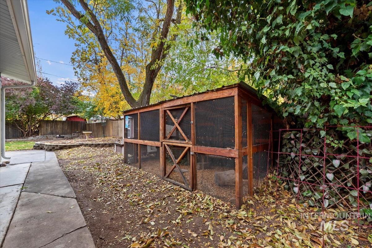 View of poultry coop featuring a fenced backyard