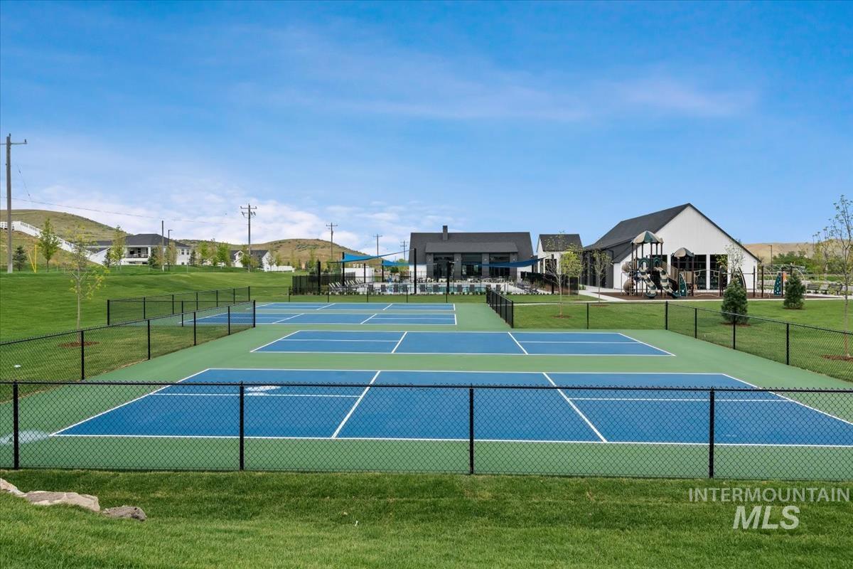 View of tennis court featuring community basketball court