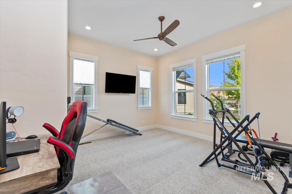 Workout room featuring carpet floors, recessed lighting, and a ceiling fan