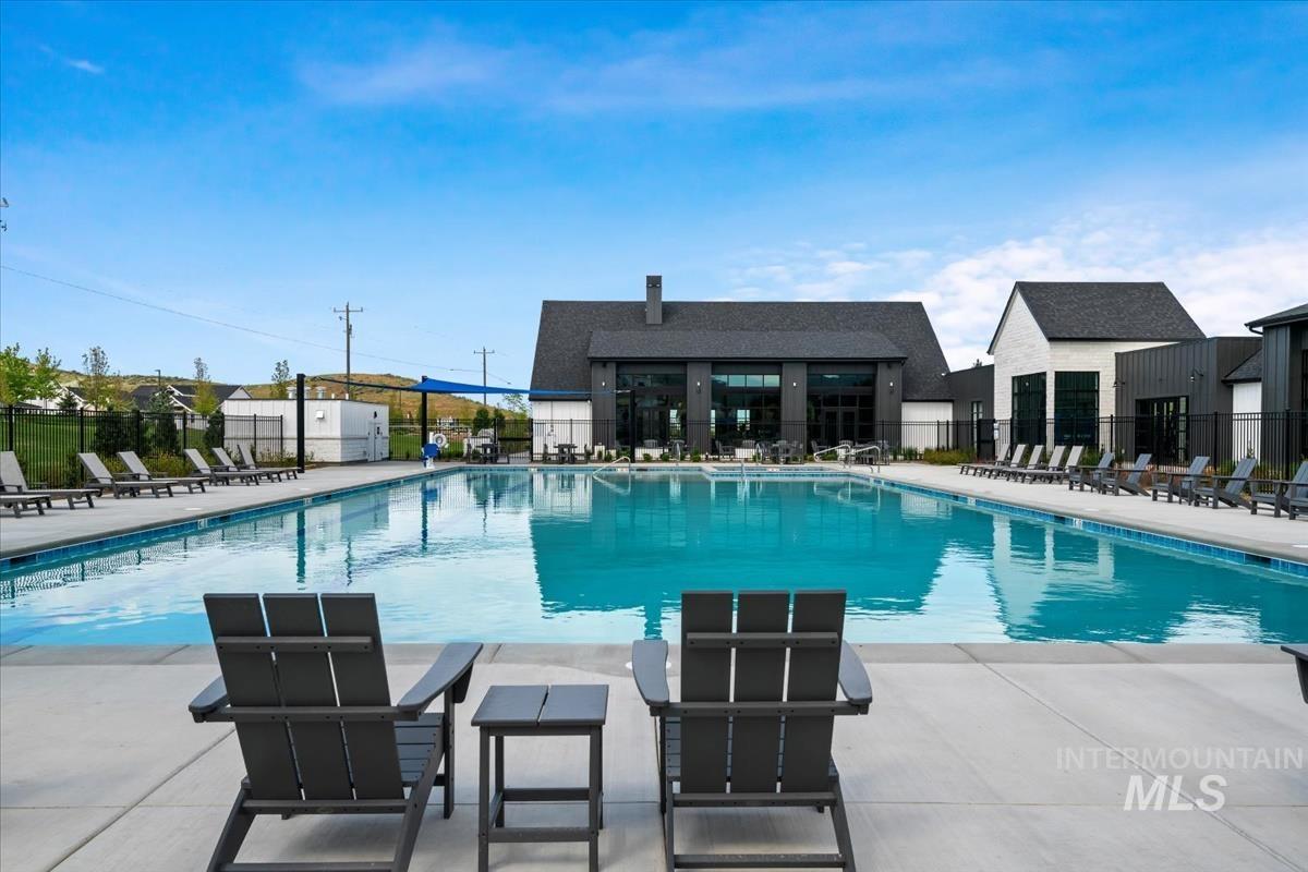 Community pool with a patio
