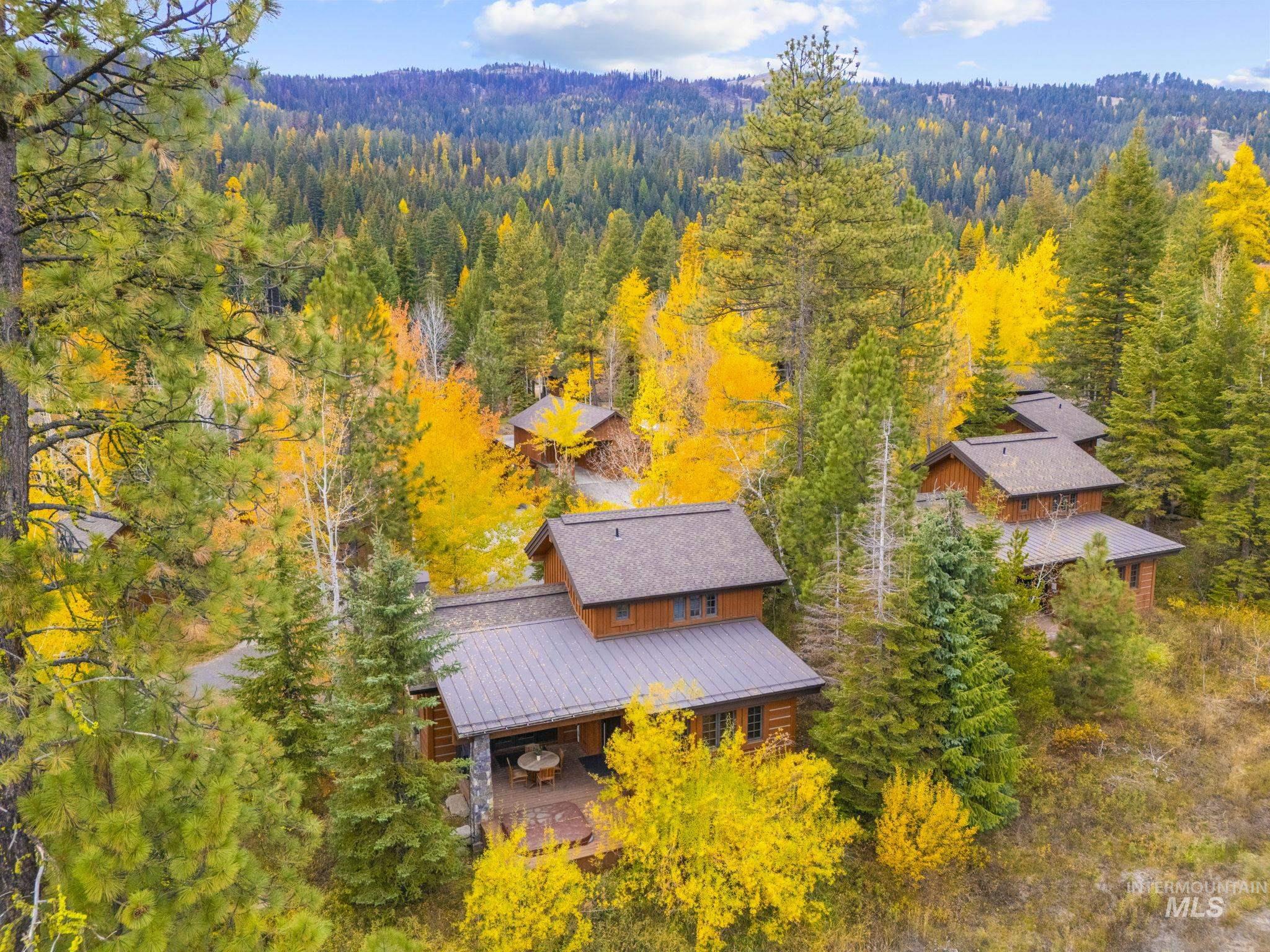 View of subject property featuring a heavily wooded area