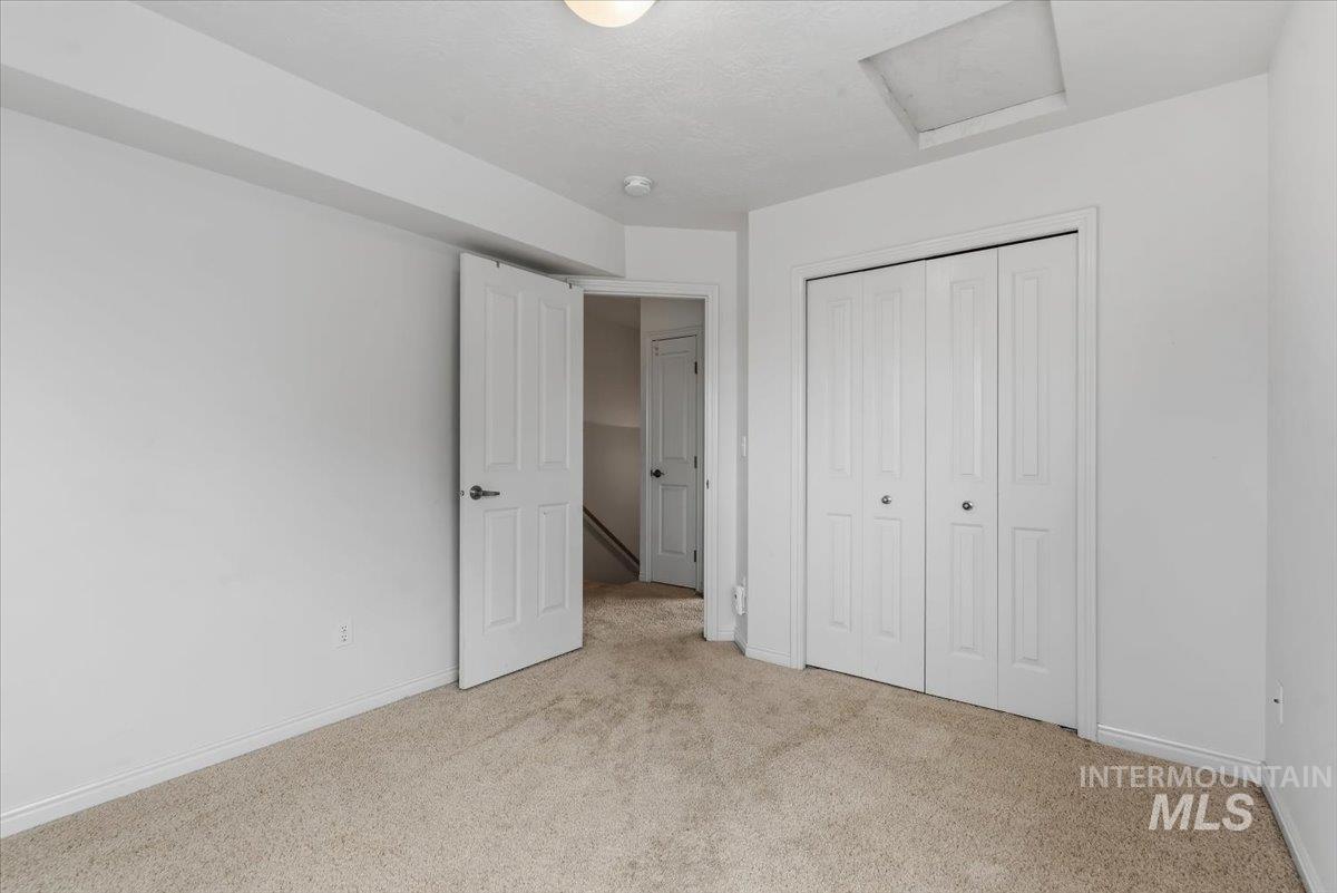 Neutral-toned carpeting and white walls