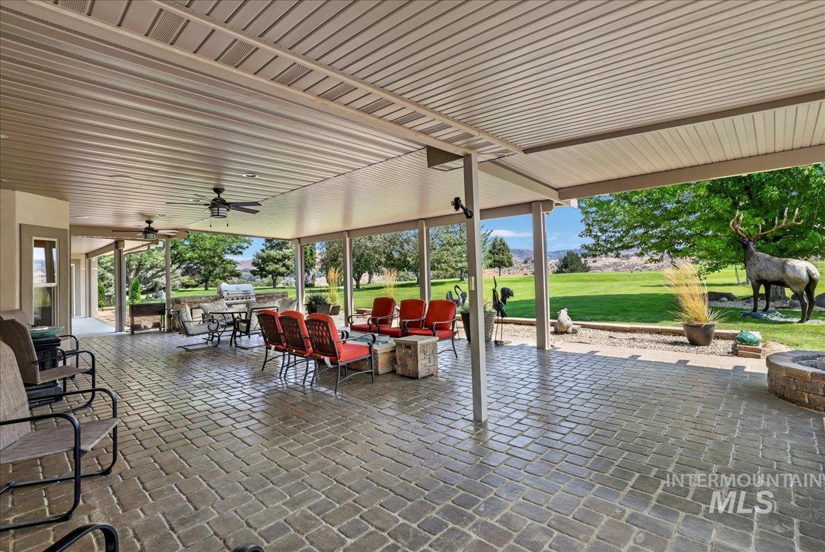 View of patio featuring ceiling fan