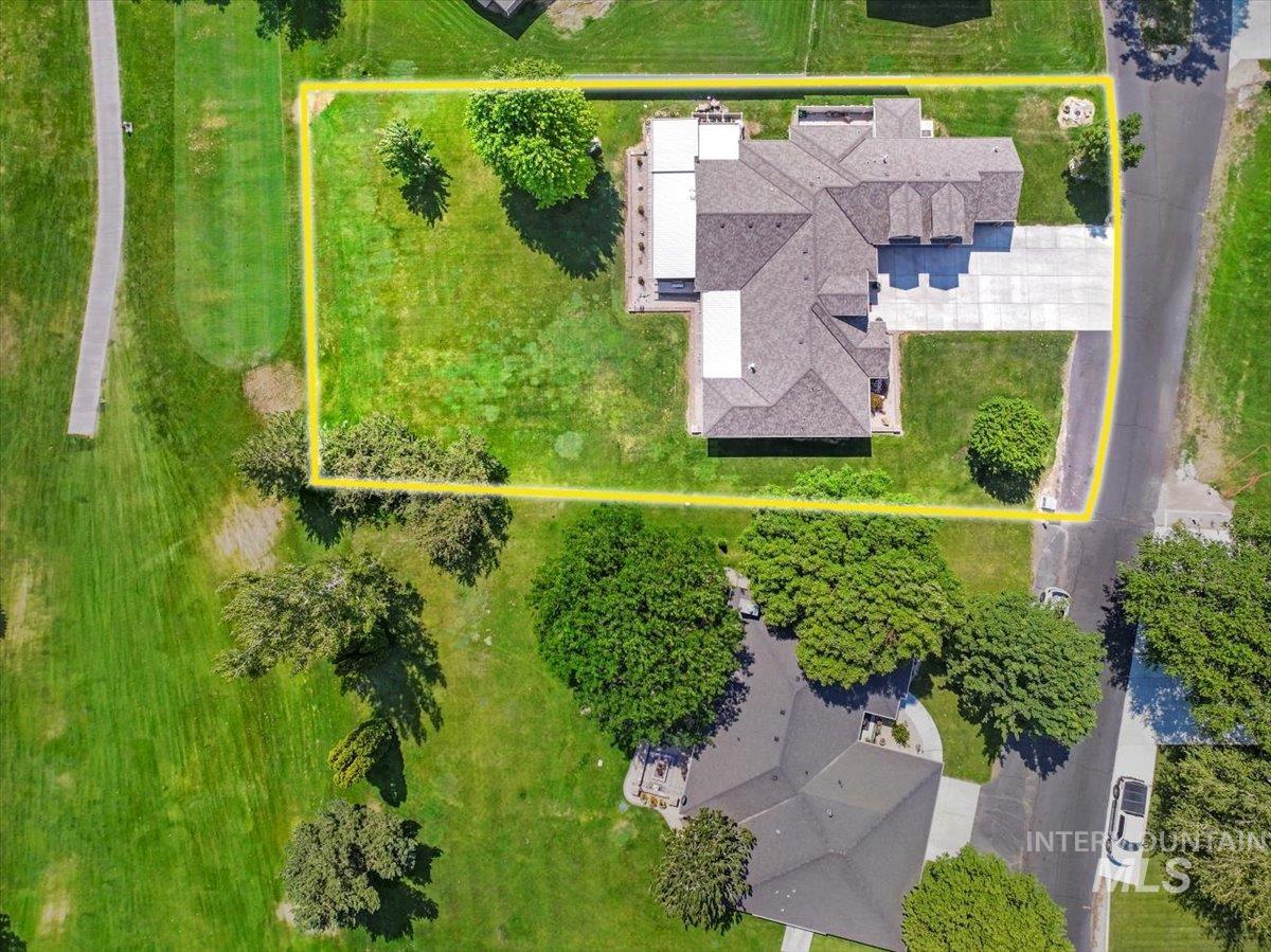 Aerial view of property and surrounding area featuring property boundaries highlighted