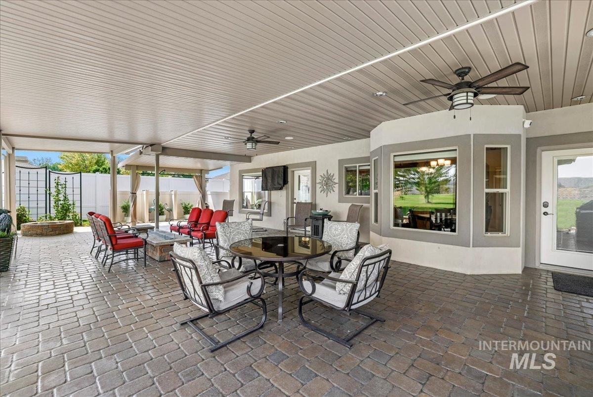 View of patio / terrace with a ceiling fan and an outdoor hangout area